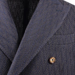 Giacca doppiopetto in lana chevron blu rever