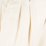 Pantalone con fibbie laterali in fresco lana sabbia pince