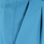Pantalone con fibbie laterali in jersey turchese tasca