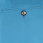 Pantalone con fibbie laterali in jersey turchese taschino