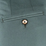 Pantalone con fibbie laterali in jersey verde taschino