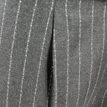 Pantalone con pince in lana verde gessata pince