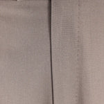 Pantalone loose fit con pince in jersey greige patta