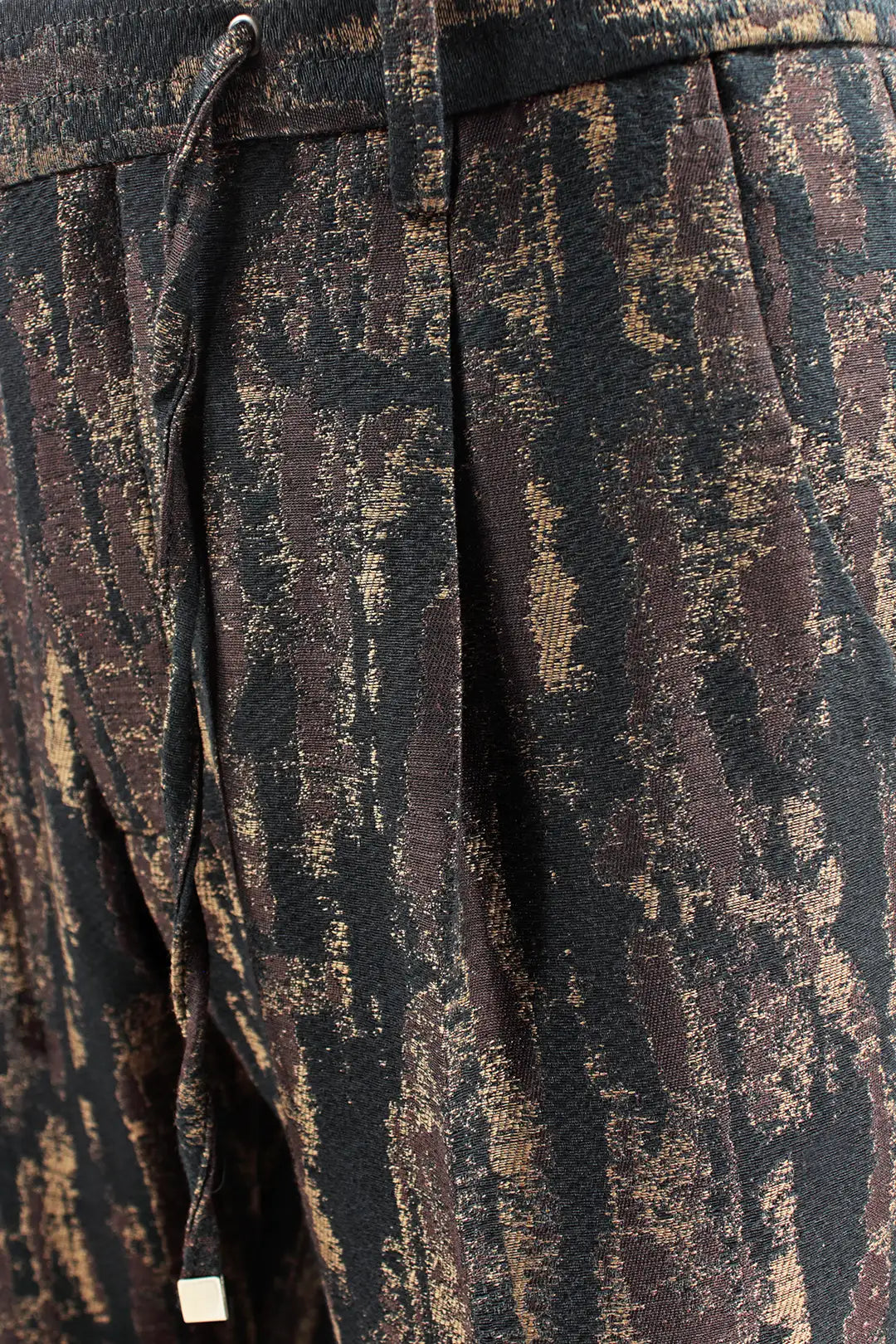 Pantalone con pince e coulisse in lana e cotone camouflage pince