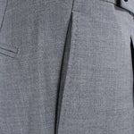 Pantalone con pince in tela di lana grigio tasca